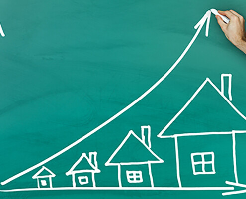 Eine Kreidezeichnung einer Statistik der Immobilienpreise auf einer grünen Tafel - Immobilienverkauf